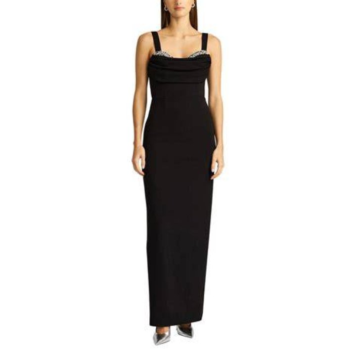 Aglow:&nbsp;Her sleeveless peekaboo gown allowed Cardi to show off her cleavage which she has confessed to having had augmented
